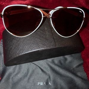 INVU white sunglasses featuring PRADA case